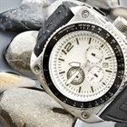 A watch is a small timepiece, typically worn either on the wrist or attached on a chain and carried in a pocket, with wristwatches being the most common type of watch used today