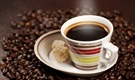 Coffee is a brewed beverage with a dark, acidic flavor prepared from the roasted seeds of the coffee plant, colloquially called coffee beans