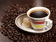 Coffee is a brewed beverage with a dark, acidic flavor prepared from the roasted seeds of the coffee plant, colloquially called coffee beans
