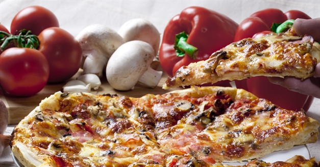Pizza is an oven-baked, flat, disc-shaped bread typically topped with a tomato sauce, cheese and various toppings.