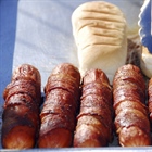 A hot dog is a sausage served in a sliced bun