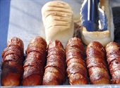 A hot dog is a sausage served in a sliced bun