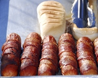 A hot dog is a sausage served in a sliced bun