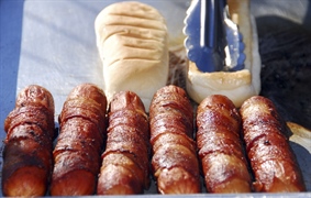 A hot dog is a sausage served in a sliced bun