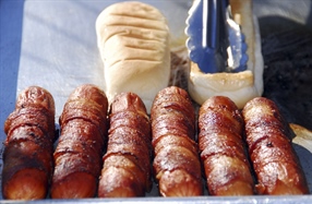 A hot dog is a sausage served in a sliced bun