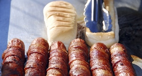 A hot dog is a sausage served in a sliced bun