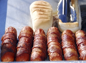 A hot dog is a sausage served in a sliced bun