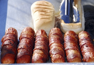 A hot dog is a sausage served in a sliced bun